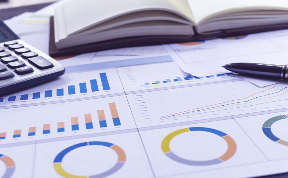 An image of financial charts, a calculator, and a ledger